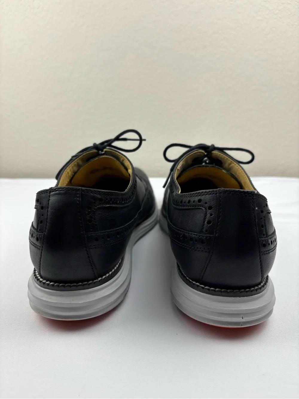 Cole Haan Original Grand wingtip Oxford shoes in black leather.